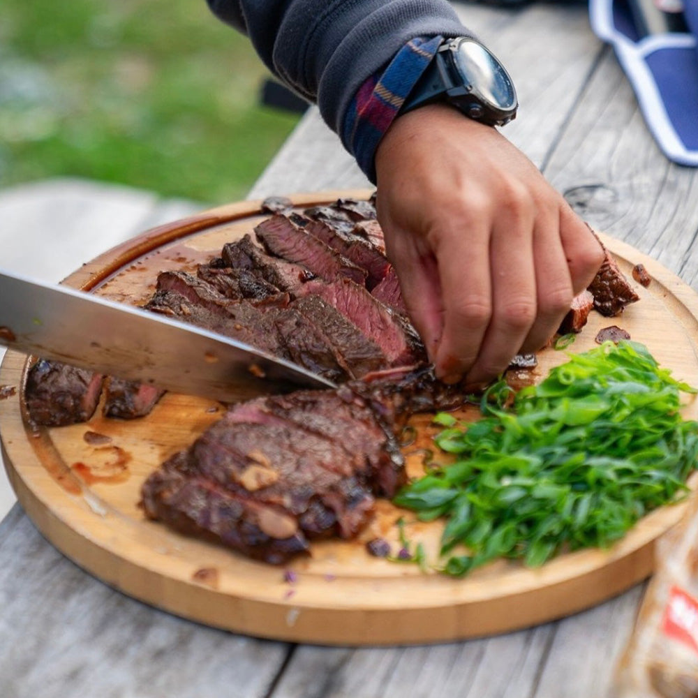 Cutting steak on a cutting board